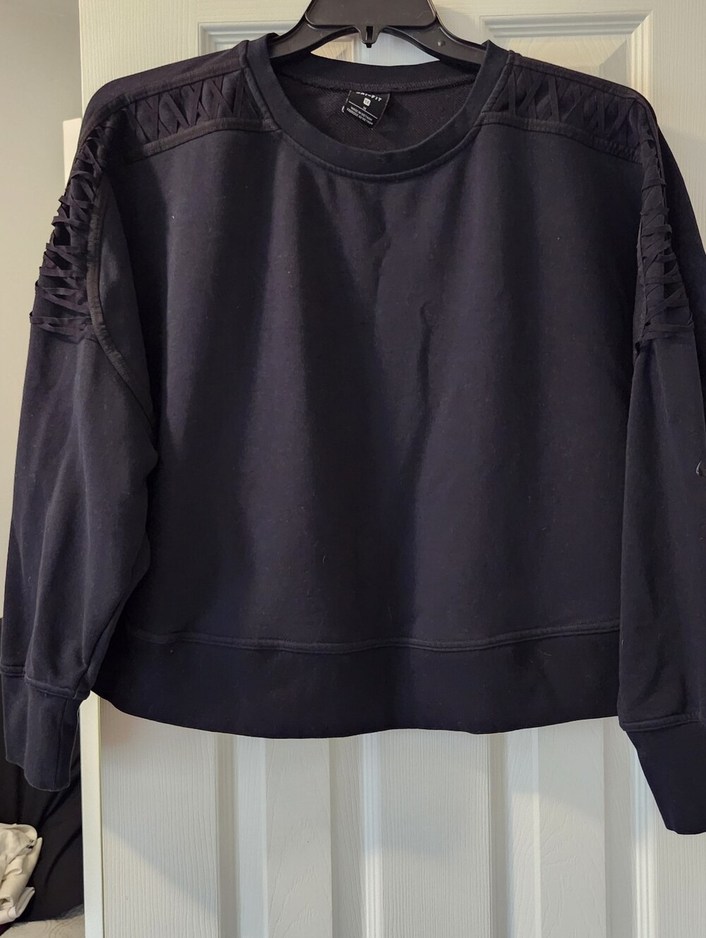 Women’s Nike black sweatshirt with Cutout Sleeve Detail, mid- drift